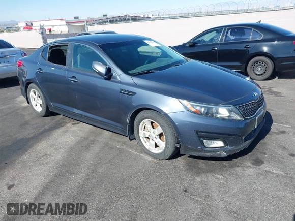 2015 Kia Optima LX z VIN KNAGM4A73F5605256, wystawiony jako IAAI lot #42459022 z przebiegiem 180 233 mil mil oraz . Historia ofert i sprzedaży dostępna na DreamBid. Obrazek 1.