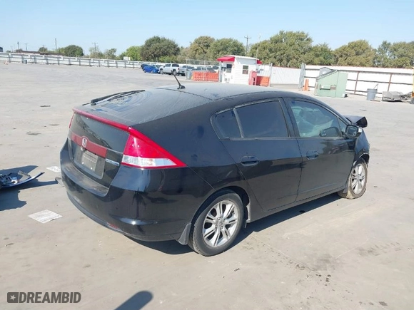 2010 Honda Insight EX with VIN JHMZE2H74AS036557, listed as a IAAI auction lot 41280150 with 110,310 mi miles. Bid and sale history available at carsss.com. Image 4.