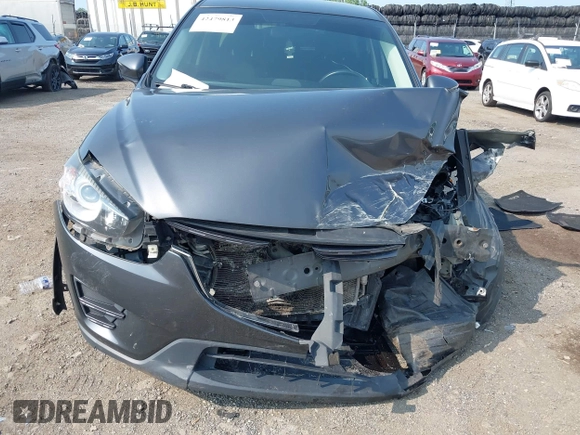 2016 Mazda CX-5 Sport with VIN JM3KE4BY7G0893984, listed as a IAAI auction lot 42479813 with Not provided miles and . Bid and sale history available at DreamBid. Image 6.