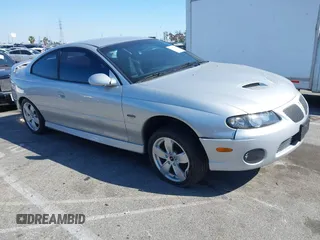 2005 Pontiac GTO with VIN 6G2VX12U05L369686, listed as a IAAI auction lot 41975716 with 64,893 mi miles. Bid and sale history available at carsss.com. Image 1.