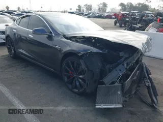 2015 Tesla Model S 85D with VIN 5YJSA1E48FF112739, listed as a IAAI auction lot 41219218 with 145,751 mi miles. Bid and sale history available at carsss.com. Image 1.