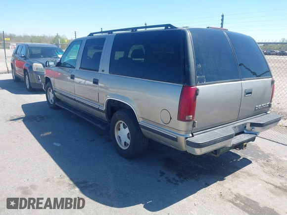 1999 Chevrolet Suburban with VIN 3GNEC16R9XG253081, listed as a IAAI auction lot 41719007 with 196,884 mi miles. Bid and sale history available at carsss.com. Image 3.