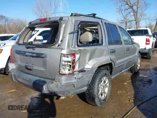2001 Jeep Grand Cherokee Laredo with VIN 1J4GX48S51C735316, listed as a IAAI auction lot 41752349 with 214,101 mi miles and . Bid and sale history available at DreamBid. Image 4.