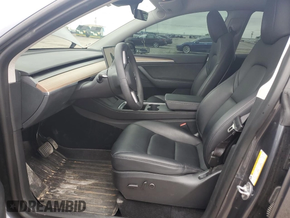2023 Tesla Model Y Long Range z VIN 7SAYGDEE4PF752292, wystawiony jako Copart lot #53824185 z przebiegiem 61 470 mil mil oraz Szkoda całkowita • Salvage title. Historia ofert i sprzedaży dostępna na DreamBid. Obrazek 7.