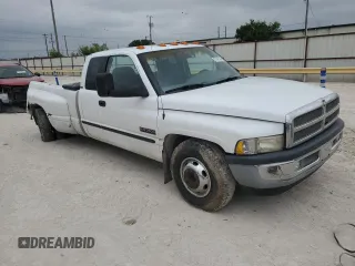 2001 Dodge Ram 3500 with VIN 1B7MC33771J257977, listed as a Copart auction lot 57947454 with 329,593 mi miles and Salvage Title. Bid and sale history available at carsss.com. Image 4.