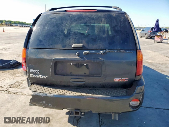 2003 GMC Envoy SLT z VIN 1GKDS13S332281271, wystawiony jako Copart lot #53685775 z przebiegiem 236 997 mil mil oraz Szkody całkowita. Historia ofert i sprzedaży dostępna na DreamBid. Obrazek 6.