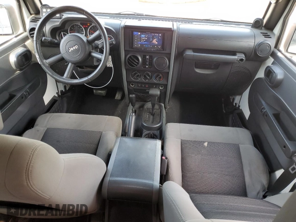 2010 Jeep Wrangler Unlimited Rubicon with VIN 1J4BA6H10AL176014, listed as a Copart auction lot 57092255 with 138,253 mi miles and Salvage title. Bid and sale history available at DreamBid. Image 8.