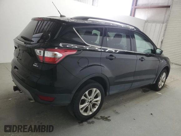 2018 Ford Escape SE z VIN 1FMCU9GD9JUD21474, wystawiony jako Copart lot #53921535 z przebiegiem 136 819 mil mil oraz Czysty tytuł • Clean title. Historia ofert i sprzedaży dostępna na DreamBid. Obrazek 3.