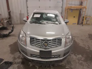 2016 Cadillac SRX Luxury Collection z VIN 3GYFNBE36GS572780, wystawiony jako IAAI lot #41347399 z przebiegiem 166 436 mil mil oraz . Historia ofert i sprzedaży dostępna na DreamBid. Obrazek 12.