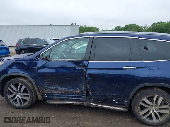 2017 Honda Pilot Touring with VIN 5FNYF6H99HB093136, listed as a IAAI auction lot 42507326 with 125,579 mi miles and . Bid and sale history available at DreamBid. Image 14.