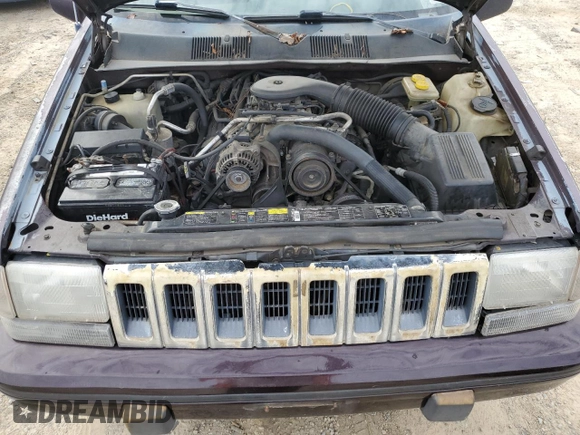 1993 Jeep Grand Wagoneer z VIN 1J4GZ88Y6PC711184, wystawiony jako Copart lot #46785895 z przebiegiem 280 127 mil mil oraz Czysty tytuł • Clean title. Historia ofert i sprzedaży dostępna na DreamBid. Obrazek 12.