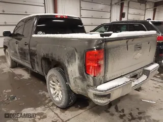 2016 Chevrolet Silverado 1500 LT with VIN 1GCRCREC8GZ137747, listed as a IAAI auction lot 41235393 with 158,487 mi miles. Bid and sale history available at carsss.com. Image 3.