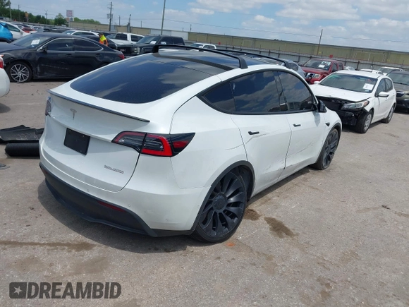 2021 Tesla Model Y Performance with VIN 5YJYGDEF9MF081798, listed as a IAAI auction lot 42033358 with 64,679 mi miles and . Bid and sale history available at DreamBid. Image 4.