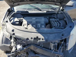 2014 Cadillac SRX z VIN 3GYFNAE37ES609830, wystawiony jako Copart lot #51542955 z przebiegiem 122 560 mil mil oraz Szkody całkowita. Historia ofert i sprzedaży dostępna na DreamBid. Obrazek 13.