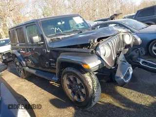 2018 Jeep Wrangler Unlimited Sahara z VIN 1C4HJXEN5JW203879, wystawiony jako IAAI lot #41131467 z przebiegiem 87 065 mil mil oraz . Historia ofert i sprzedaży dostępna na DreamBid. Obrazek 1.