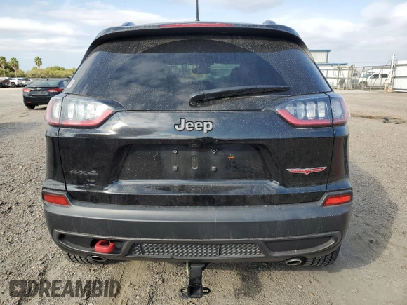 2022 Jeep Cherokee Trailhawk with VIN 1C4PJMBX8ND554044, listed as a Copart auction lot 82687464 with 13,353 mi miles and Salvage Title. Bid and sale history available at carsss.com. Image 6.
