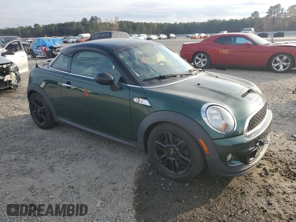 2013 MINI Coupe S z VIN WMWSX3C51DT409008, wystawiony jako Copart lot #82781914 z przebiegiem 122 465 mil mil oraz Czysty tytuł • Clean title. Historia ofert i sprzedaży dostępna na DreamBid. Obrazek 4.