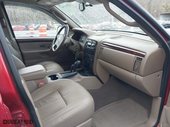 2004 Jeep Grand Cherokee Limited with VIN 1J4GW58S94C299311, listed as a IAAI auction lot 41912467 with 55,736 mi miles. Bid and sale history available at carsss.com. Image 5.