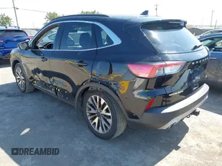 2020 Ford Escape Titanium z VIN 1FMCU9J97LUB18350, wystawiony jako IAAI lot #42574736 z przebiegiem 82 551 mil mil oraz . Historia ofert i sprzedaży dostępna na DreamBid. Obrazek 3.