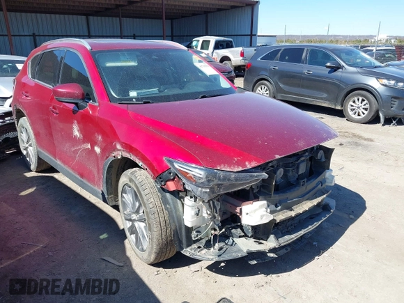2020 Mazda CX-5 Grand Touring with VIN JM3KFADM3L0761286, listed as a IAAI auction lot 41715379 with 145,656 mi miles and . Bid and sale history available at DreamBid. Image 1.