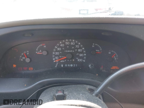 1999 Ford Econoline Cargo with VIN 1FDRE14W3XHB36482, listed as a IAAI auction lot 41393346 with 130,669 mi miles. Bid and sale history available at carsss.com. Image 7.