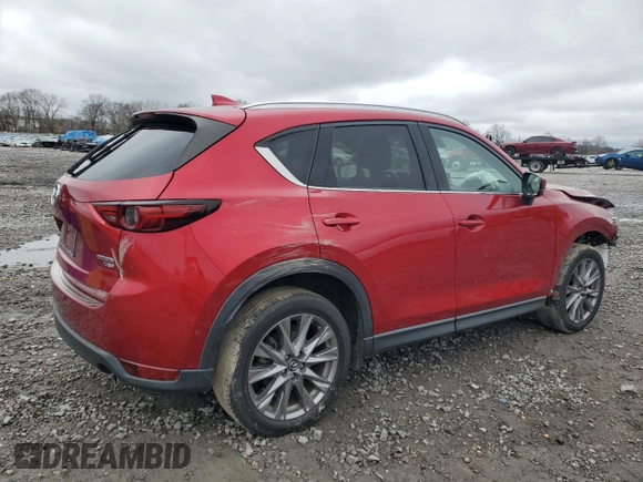 2021 Mazda CX-5 Grand Touring Reserve with VIN JM3KFBAY5M0313517, listed as a Copart auction lot 42815805 with 34,028 mi miles and Salvage Title. Bid and sale history available at carsss.com. Image 3.