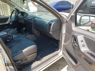 2004 Jeep Grand Cherokee Laredo with VIN 1J4GW48S94C369643, listed as a IAAI auction lot 42693998 with 225,033 mi miles and . Bid and sale history available at DreamBid. Image 5.