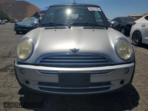 2006 MINI Convertible with VIN WMWRF33576TG16056, listed as a Copart auction lot 63127705 with 108,654 mi miles and Salvage title. Bid and sale history available at DreamBid. Image 5.