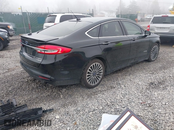 2018 Ford Fusion Titanium with VIN 3FA6P0RU7JR182119, listed as a IAAI auction lot 41984816 with 146,748 mi miles and . Bid and sale history available at DreamBid. Image 4.