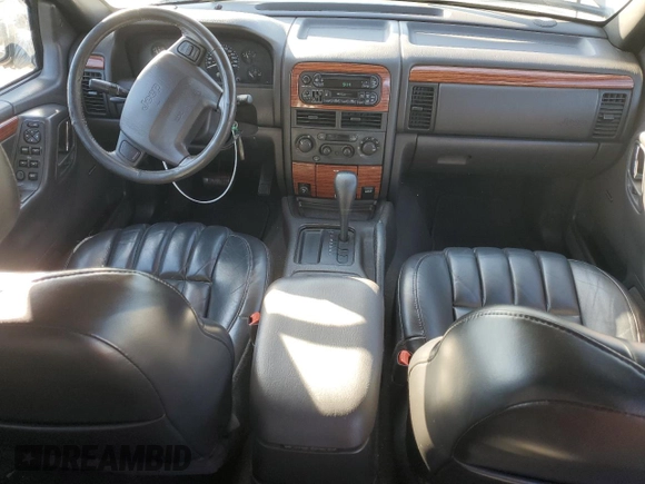 1999 Jeep Grand Cherokee Limited with VIN 1J4G268SXXC759016, listed as a Copart auction lot 80307534 with 215,870 mi miles and Salvage title. Bid and sale history available at DreamBid. Image 8.