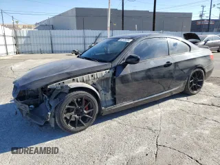 2012 BMW 3 Series 335is with VIN WBAKG1C52CE839671, listed as a Copart auction lot 82129304 with 121,963 mi miles and Salvage title. Bid and sale history available at DreamBid. Image 1.