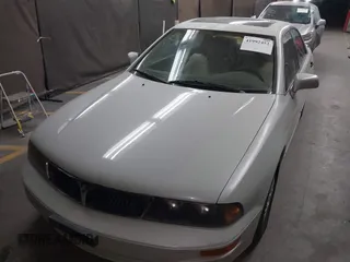1999 Mitsubishi Diamante z VIN 6MMAP47P4XT003895, wystawiony jako IAAI lot #41992452 z przebiegiem 170 964 mil mil oraz . Historia ofert i sprzedaży dostępna na DreamBid. Obrazek 6.