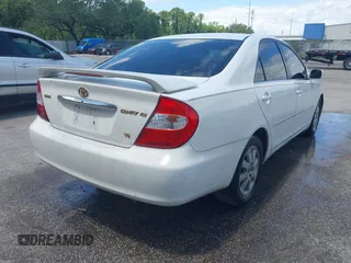 2002 Toyota Camry XLE z VIN 4T1BF32K42U035090, wystawiony jako IAAI lot #42250135 z przebiegiem 176 364 mil mil oraz . Historia ofert i sprzedaży dostępna na DreamBid. Obrazek 4.