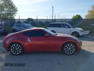 2014 Nissan 370Z Nismo with VIN JN1AZ4EH9EM636340, listed as a IAAI auction lot 42112548 with 143,894 mi miles and . Bid and sale history available at DreamBid. Image 14.