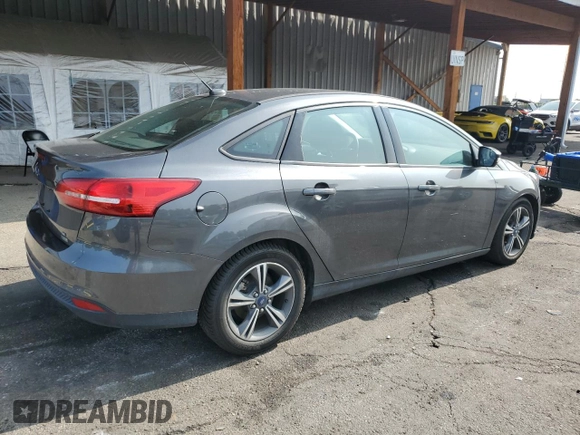2016 Ford Focus SE z VIN 1FADP3FE7GL238752, wystawiony jako Copart lot #59226335 z przebiegiem 46 289 mil mil oraz Czysty tytuł • Clean title. Historia ofert i sprzedaży dostępna na DreamBid. Obrazek 3.