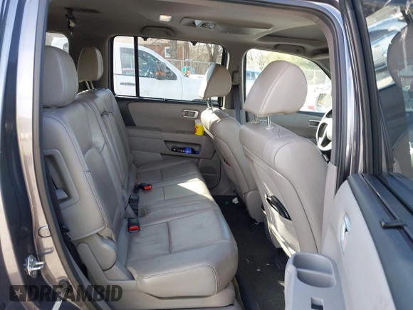 2014 Honda Pilot Touring with VIN 5FNYF4H95EB019048, listed as a IAAI auction lot 41526958 with 172,252 mi miles and . Bid and sale history available at DreamBid. Image 8.
