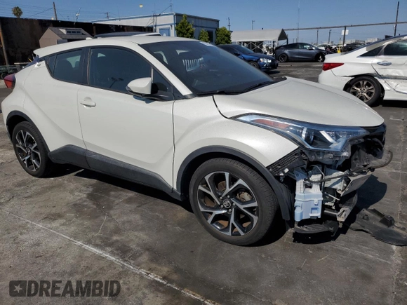 2018 Toyota C-HR XLE z VIN NMTKHMBX8JR015992, wystawiony jako Copart lot #65197115 z przebiegiem 49 226 mil mil oraz Szkoda całkowita • Salvage title. Historia ofert i sprzedaży dostępna na DreamBid. Obrazek 4.