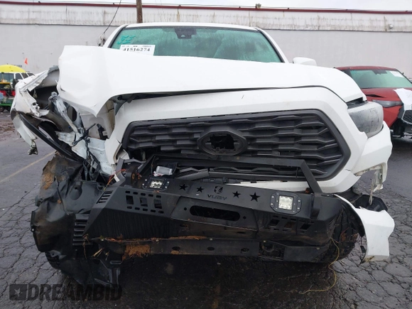 2021 Toyota Tacoma SR5 with VIN 3TMDZ5BN1MM100575, listed as a IAAI auction lot 41516274 with 61,974 mi miles and . Bid and sale history available at DreamBid. Image 6.