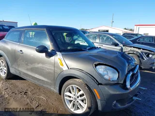 2013 MINI Cooper Paceman with VIN WMWSS1C52DWN46525, listed as a IAAI auction lot 41643631 with 126,392 mi miles. Bid and sale history available at carsss.com. Image 1.