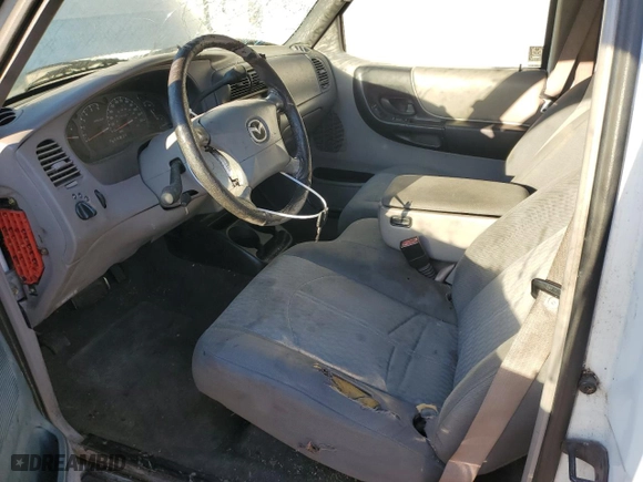 2001 Mazda B-Series 2WD Truck DS with VIN 4F4YR12U41TM25842, listed as a Copart auction lot 76827864 with 252,323 mi miles and Salvage Title. Bid and sale history available at carsss.com. Image 7.