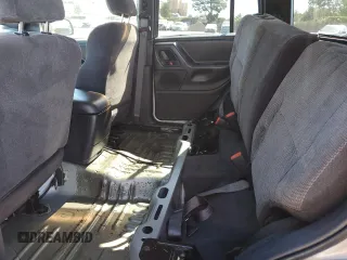 1999 Jeep Grand Cherokee Laredo with VIN 1J4GW58N4XC739465, listed as a Copart auction lot 76130544 with 195,649 mi miles and Salvage title. Bid and sale history available at DreamBid. Image 11.