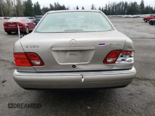 1999 Mercedes-Benz E-Class with VIN WDBJF82H2XX015586, listed as a Copart auction lot 44465455 with 76,890 mi miles and Salvage Title. Bid and sale history available at carsss.com. Image 6.