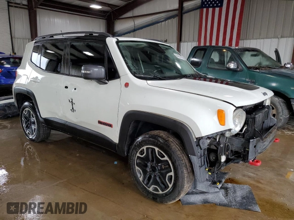 2015 Jeep Renegade Trailhawk with VIN ZACCJBCT8FPB78351, listed as a Copart auction lot 64036095 with 127,784 mi miles and Salvage title. Bid and sale history available at DreamBid. Image 4.