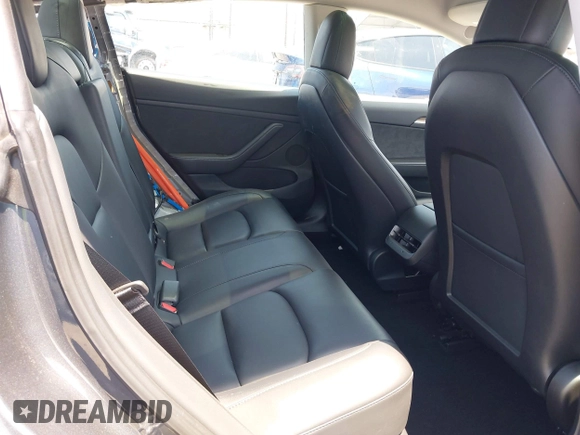 2023 Tesla Model 3 with VIN 5YJ3E1EA4PF400306, listed as a IAAI auction lot 42398603 with 18,551 mi miles and . Bid and sale history available at DreamBid. Image 8.