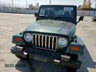2000 Jeep Wrangler Sahara z VIN 1J4FA59S1YP746043, wystawiony jako Copart lot #58842665 z przebiegiem 148 348 mil mil oraz Szkoda całkowita • Salvage title. Historia ofert i sprzedaży dostępna na DreamBid. Obrazek 13.