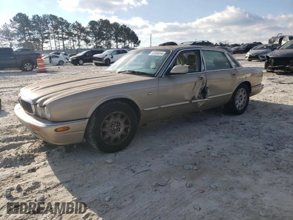 1998 Jaguar XJ with VIN SAJHX1242WC845736, listed as a Copart auction lot 82006044 with 188,785 mi miles and Salvage title. Bid and sale history available at DreamBid. Image 1.