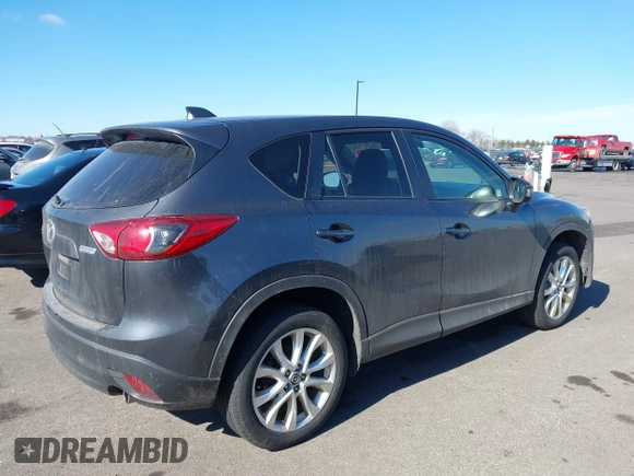 2014 Mazda CX-5 Grand Touring with VIN JM3KE4DY1E0364685, listed as a IAAI auction lot 41665349 with 135,751 mi miles. Bid and sale history available at carsss.com. Image 4.