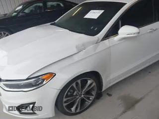 2019 Ford Fusion Titanium with VIN 3FA6P0K95KR271291, listed as a IAAI auction lot 41983320 with 71,962 mi miles and . Bid and sale history available at DreamBid. Image 21.