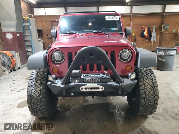 2012 Jeep Wrangler Unlimited Sport z VIN 1C4BJWDG8CL282181, wystawiony jako Copart lot #53863375 z przebiegiem 92 984 mil mil oraz Szkoda całkowita • Salvage title. Historia ofert i sprzedaży dostępna na DreamBid. Obrazek 5.