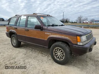 1993 Jeep Grand Wagoneer z VIN 1J4GZ88Y6PC711184, wystawiony jako Copart lot #46785895 z przebiegiem 280 127 mil mil oraz Czysty tytuł • Clean title. Historia ofert i sprzedaży dostępna na DreamBid. Obrazek 4.
